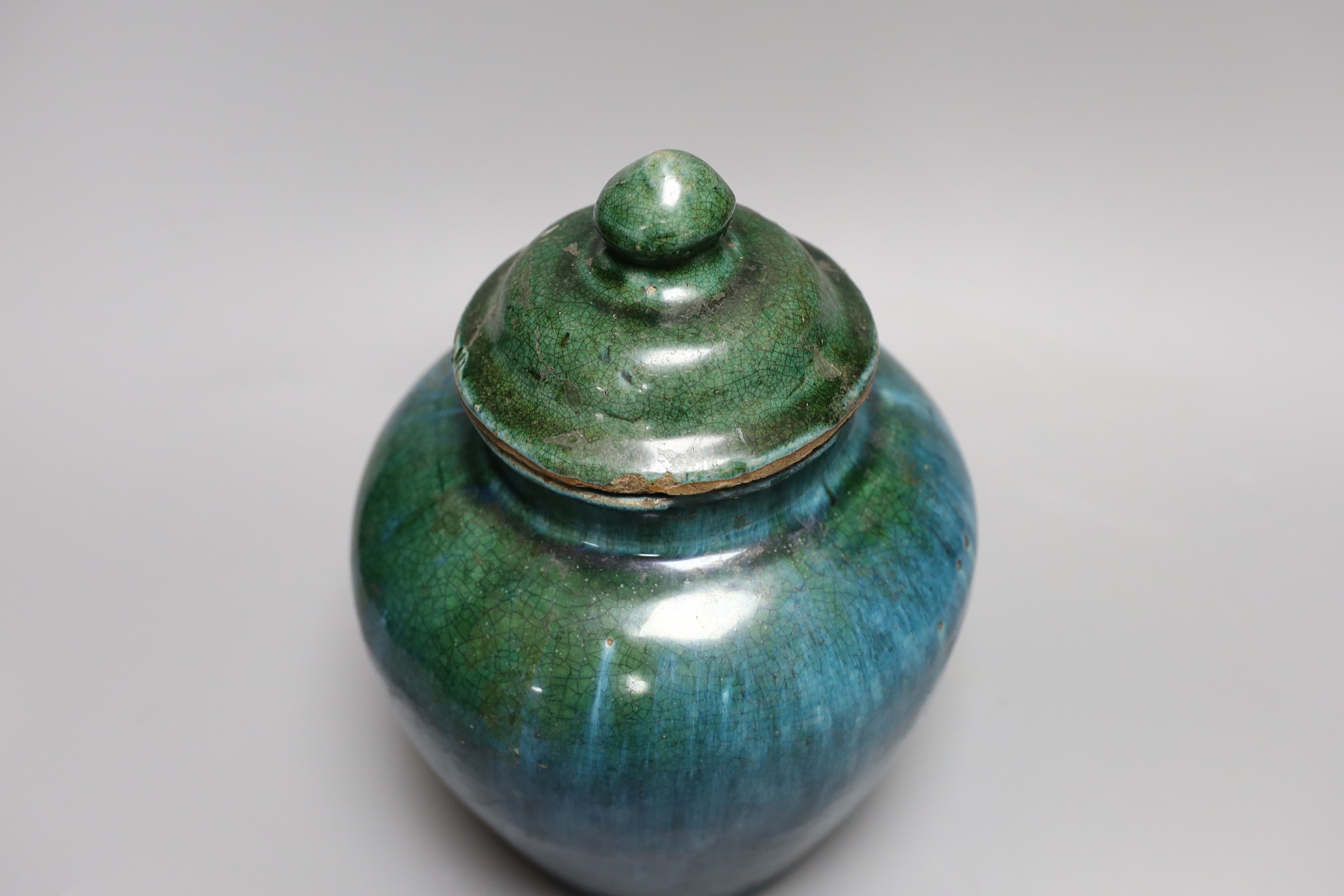 A Chinese mottle glazed terracotta jar and cover, 19th century, 24 cms high